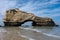 Arched rock at low tide at the beach of Biarritz, France