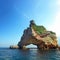 Arched rock in the middle of the sea