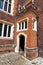 Arched rustic door in a stone wall at Hampton Court Palace