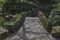 Arched stone bridge with cobbled path in Pittencrieff Park Dunfermline, Scotland, UK