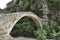 Arched stone bridge in Greece