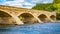 Arched Stone Bridge Over a River