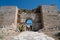 Arched stone entranceway of a castle or citadel square from ancient times