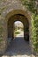 Arched Walkway With Open Door