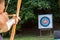 Archer aiming arrow at sport aim