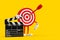 Archery Target and Dart in Center Cartoon Person Character Mascot with Movie Clapper Board. 3d Rendering