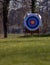 archery target placed in a meadow for archer training.