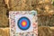 Archery target on straw background
