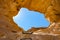 The Arches, amazing round hole in the rock, closed arch in ancient cooper mines canyons and mountains range in Timna National Park