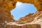 The Arches, amazing round hole in the rock, closed arch in ancient cooper mines canyons and mountains range in Timna National Park