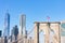 Arches on the Brooklyn Bridge with an American Flag and the Lower Manhattan New York City Skyline
