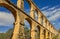 Arches of the old stone Roman aqueduct in Tarragona, Catalonia,