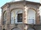 Arches with railings and small lamps in a central building in Antequera in Spain