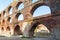 Arches in a ruin of a monastery building of red brick, Northern