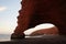 Arches in sandstone rocks at early sunset