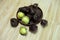 Archidendron pauciflorum fruits on wooden background