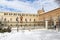 archiepiscopal palace of alcala de henares covered in snow on a sunny day after a snowfall