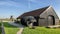 Archimedes screw, storage house and windmill by the Schermerhorn Museum Mill, Stompetoren, Netherlands