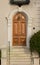 Arching Wooden Door on Old House