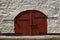 Arching wooden doors secured by locks on an old medieval castle in Kinsale, Ireland