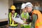 Architect caucasian man and woman working with colleagues mixed race in the construction site. Architecture engineering on big