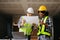 Architect caucasian man and woman working with colleagues mixed race in the construction site. Architecture engineering on big