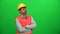 Architect or construction worker looking up on green screen. Left side.