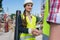 Architect and engineer or supervisor shaking hands on the construction site