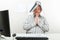 Architect With Folder On Head Praying At Desk