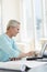 Architect Using Laptop At Desk