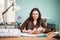 Architect woman in her office with color cards in front