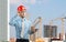 Architect worker or engineer man in red construction helmet