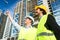 Architects on large construction site giving instructions