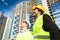 Architects on large construction site giving instructions