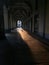 Architectural arcade with sunrays and shadows in the street of turin