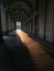 Architectural arcade with sunrays and shadows in the street of turin