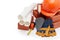 Architectural blueprints, stack of bricks, masonry trowel,  construction hard hat on white background. Construction concept