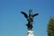 Architectural detail of Baroque bronze statue in Rome.