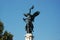 Architectural detail of Baroque bronze statue in Rome.