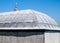 Architectural detail of a  dome on a roof  against blue sky on Islamic  building