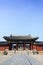Architectural detail - Korean Tradition red wooden pole and outdoor stone wall, decoration brick wall and .courtyard from