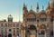 Architectural details of Basilica di San Marco and Ancient clock tower Torre dell`Orologio, Venice, Italy
