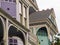 Architectural details and colorful paint job on exterior of Victorian House in Lower Garde