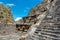 Architectural details with dragon head sink drain of  significant Mesoamerican pyramids and green grassland located at at