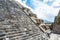 Architectural details with dragon head sink drain of  significant Mesoamerican pyramids and green grassland located at at