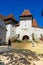 Architectural details of medieval church. View of fortified church of Viscri, UNESCO heritage site in Transylvania. Romania, 2021