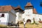 Architectural details of medieval church. View of fortified church of Viscri, UNESCO heritage site in Transylvania. Romania, 2021