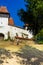 Architectural details of medieval church. View of fortified church of Viscri, UNESCO heritage site in Transylvania. Romania, 2021