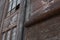 Architectural details of old industrial building, brick work with rusting roll up door