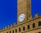 Architectural details of Palazzo Vecchio and its clock tower in the histocial center of Florence, Italy